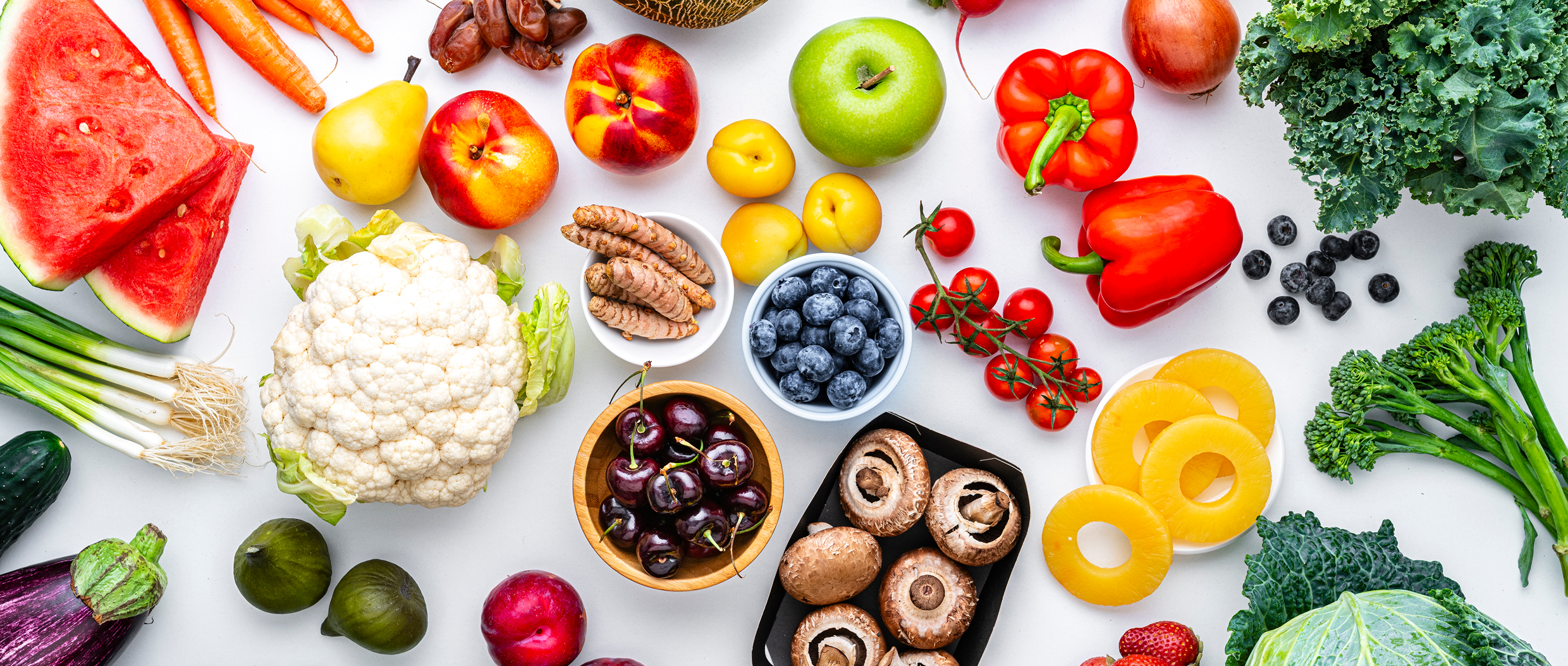 Assorted fresh fruits and vegetables on display.