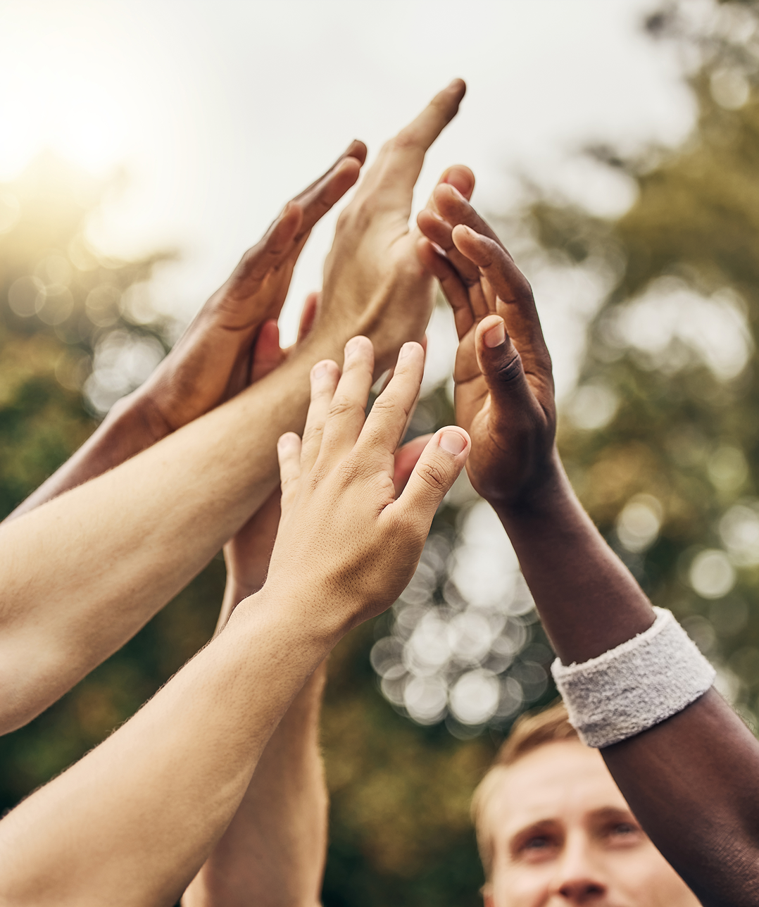 Hands reaching up for a high-five.